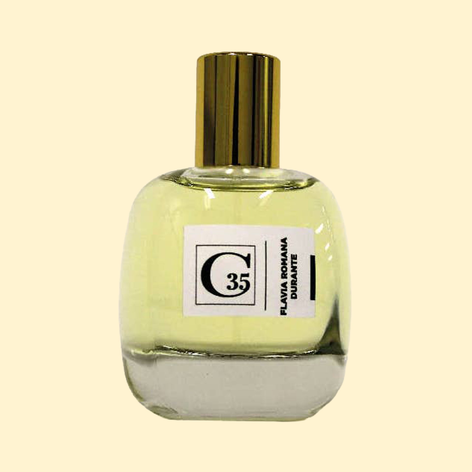 A studio product photograph of a clear glass perfume bottle filled with pale yellow-green fragrance, topped with a reflective gold cylindrical cap and set against a soft cream background. A white label on the front displays the Collection Trente-Cinq logo and the name “Flavia Romana Durante.” The transparent bottle reveals the light-colored perfume, while soft reflections on the glass emphasize its rounded, sculptural shape.