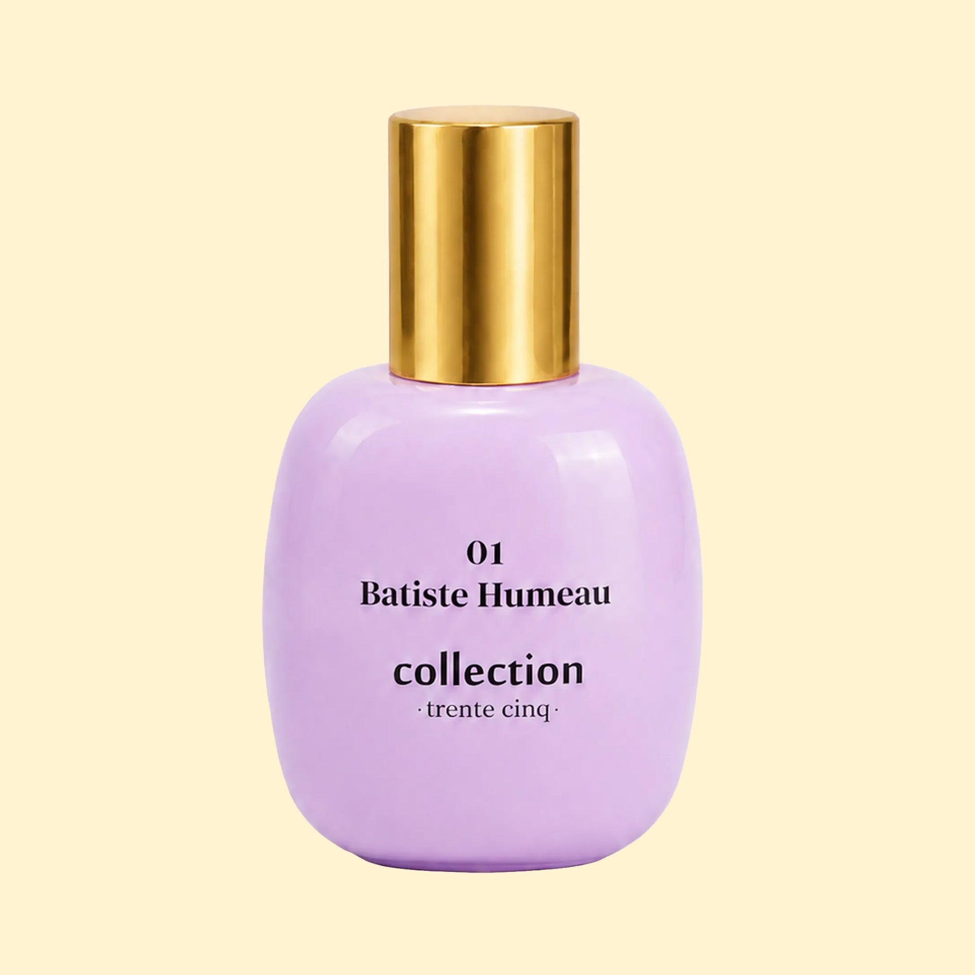 A studio product photograph of a rounded lavender-purple perfume bottle with a reflective gold cylindrical cap, set against a soft cream background. Black text on the bottle reads “01 Batiste Humeau” and “collection ·trente cinq·”. The bottle has a glossy finish with subtle reflections highlighting its curved shape.