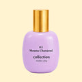 A studio product photograph of a rounded lavender-purple perfume bottle with a reflective gold cylindrical cap, set against a soft cream background. Black text on the bottle reads “03 Mouna Chanaoui” and “collection ·trente cinq·”. The bottle’s glossy finish catches soft reflections, highlighting its smooth, rounded silhouette.