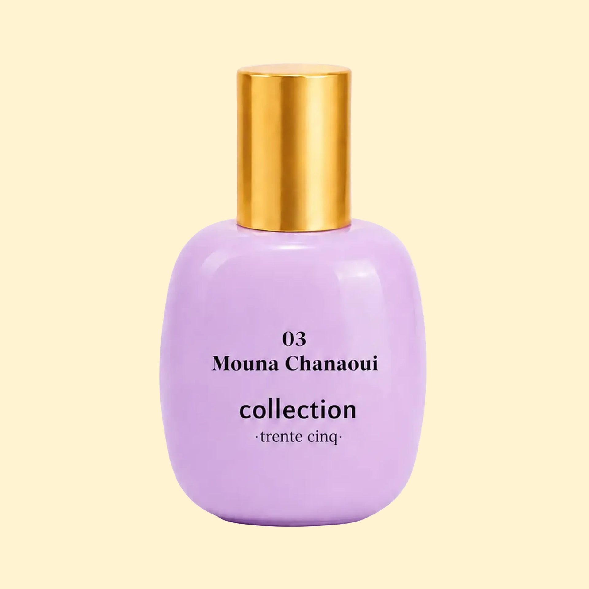 A studio product photograph of a rounded lavender-purple perfume bottle with a reflective gold cylindrical cap, set against a soft cream background. Black text on the bottle reads “03 Mouna Chanaoui” and “collection ·trente cinq·”. The bottle’s glossy finish catches soft reflections, highlighting its smooth, rounded silhouette.