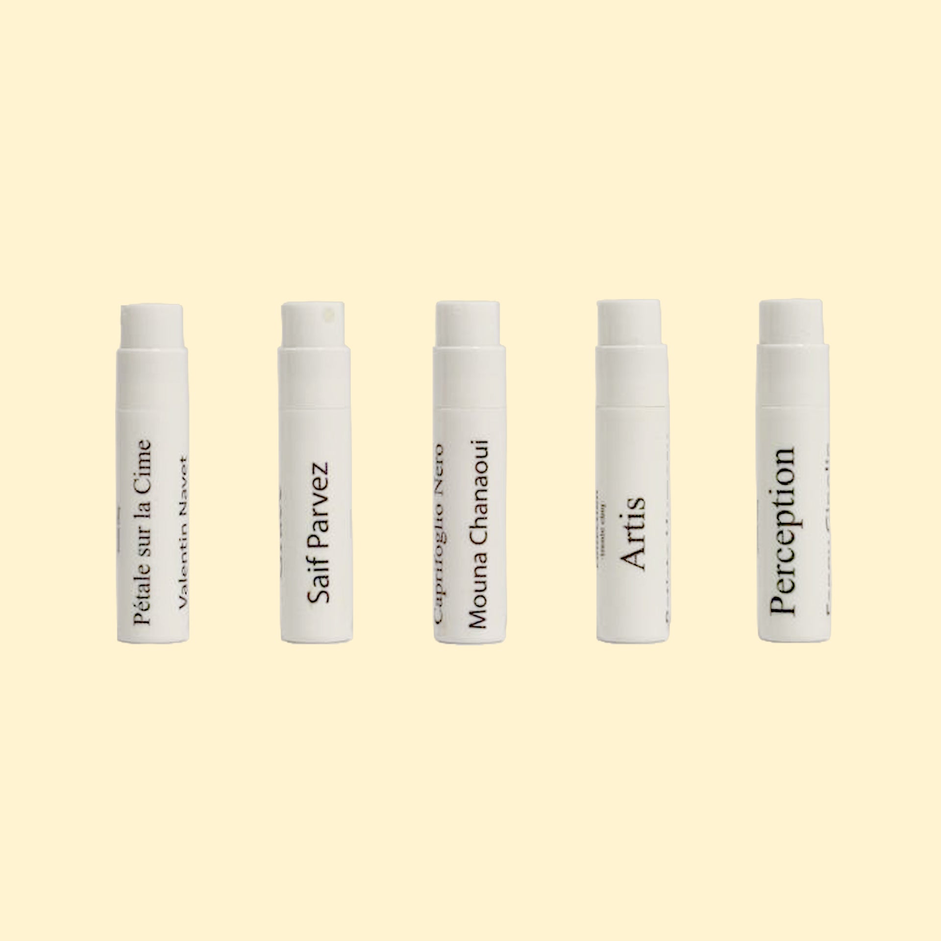 A studio product photograph showing five white perfume sample spray vials arranged in a horizontal row against a soft cream background. Each vial is labeled with a fragrance name from the Centifolia Impressionnée collection, including Pétale sur la Cime, Grace, Caprifoglio Nero, Artis, and Perception. The minimalist vials feature black typography and are evenly spaced, highlighting the discovery set format.