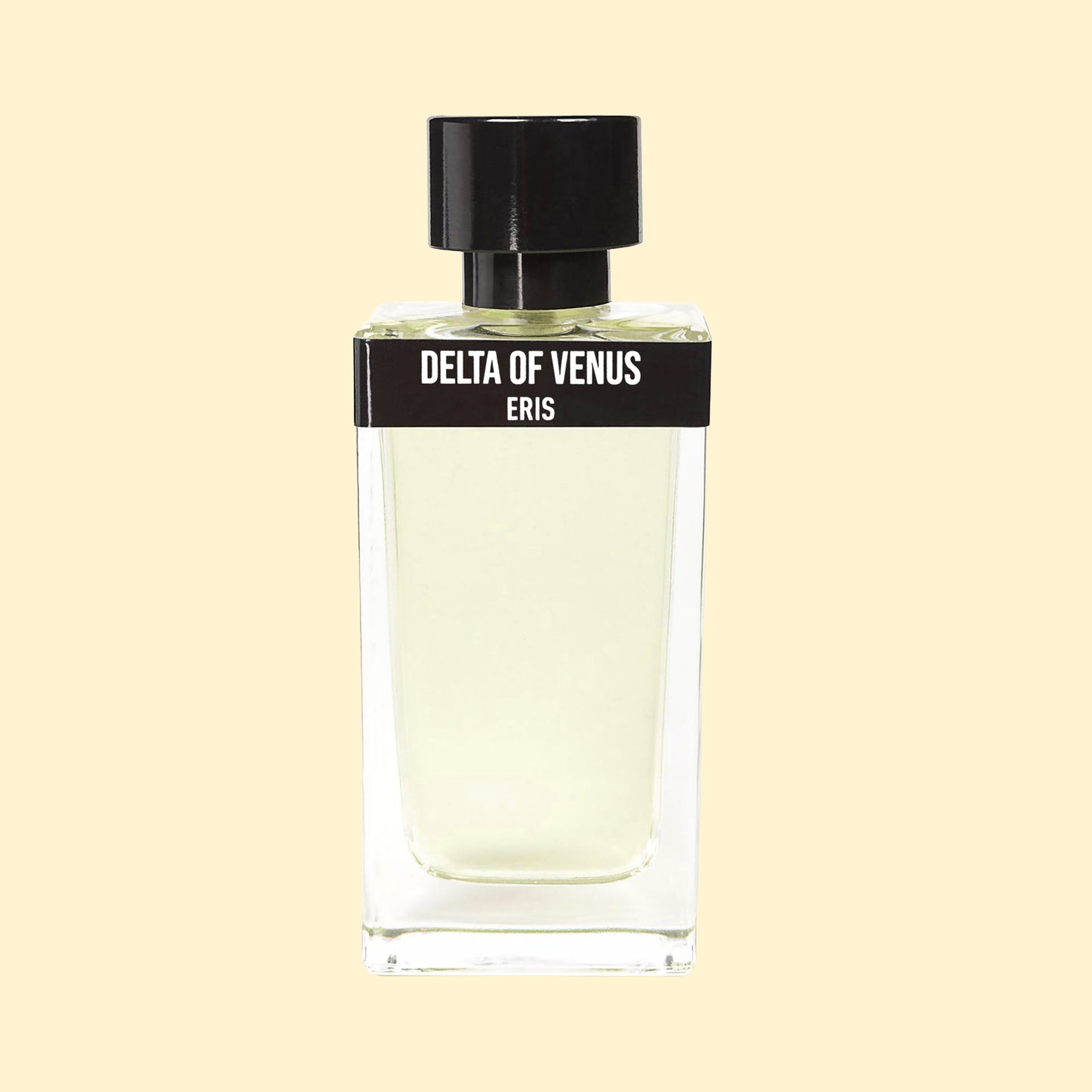 Delta of Venus by ERIS Parfums in a clear glass perfume bottle with pale yellow fragrance and black cap against a cream background.