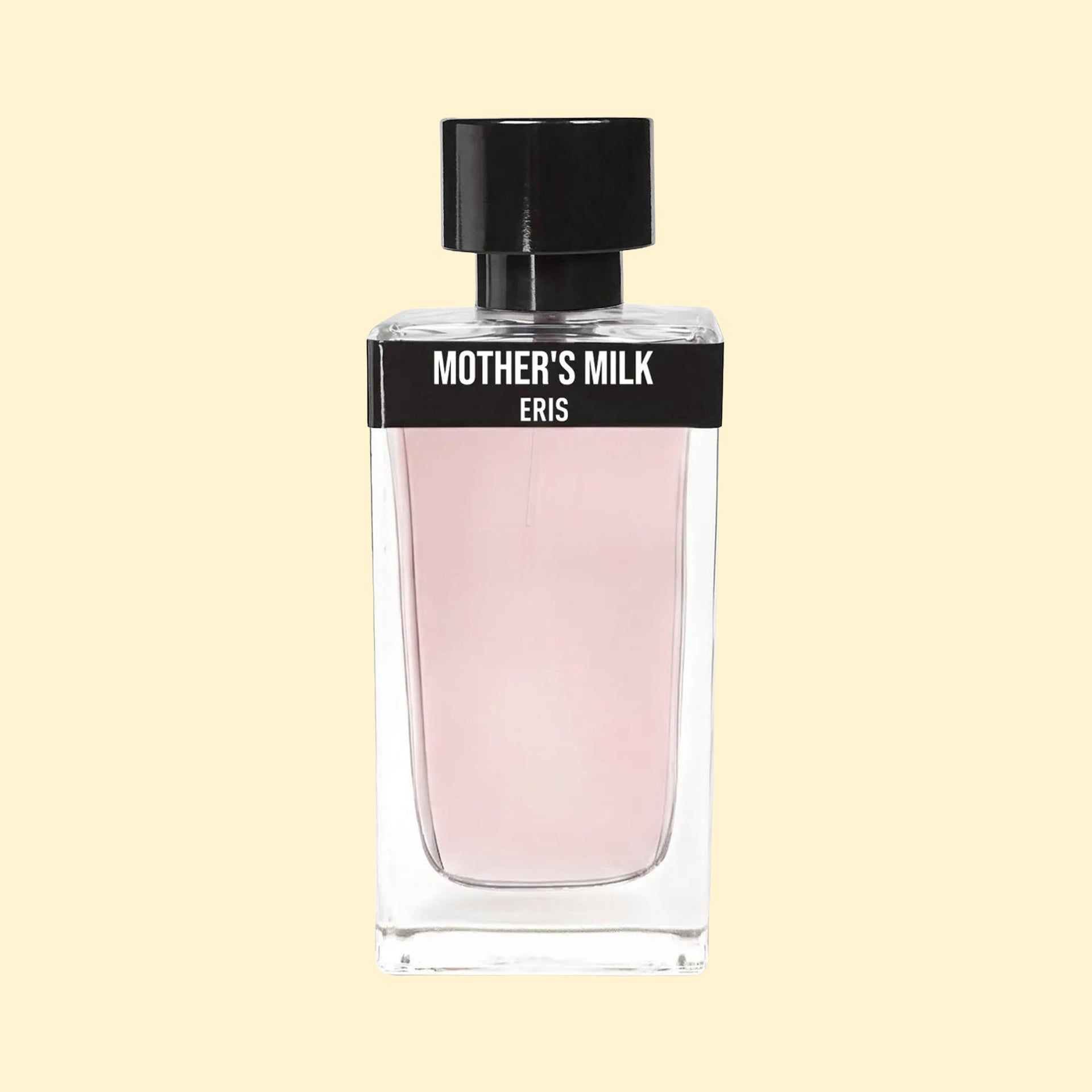 ERIS PARFUMS Mother’s Milk eau de parfum in a clear glass bottle with pale pink fragrance, black label and black cap, photographed against a soft cream background.