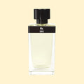 Mx. by ERIS Parfums in a clear glass perfume bottle with pale green fragrance, black label and black cap against a cream background.