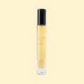 MISKEO Parfums Allégorie de l'Été Eau de Toilette in a slim clear glass travel spray bottle with a glossy black cap. The pale golden fragrance is presented against a soft beige background, highlighting the minimalist design and warm summer-inspired aesthetic.