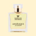 Papillon Artisan Perfumes Angélique Eau de Parfum in a clear rectangular glass bottle with a white cap and gold collar, filled with pale straw-coloured fragrance against a soft cream background.