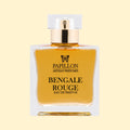 Papillon Artisan Perfumes Bengale Rouge Eau de Parfum in a clear rectangular glass bottle with a white cap and gold collar, filled with warm golden-amber fragrance against a soft cream background.