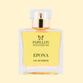 Papillon Artisan Perfumes Epona Eau de Parfum in a clear rectangular glass bottle with a white cap and gold collar, filled with pale golden fragrance against a soft cream background.